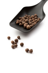 Spoon and pepper isolated on white