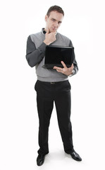 Serious and thinking businessman with laptop in hands
