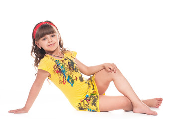 Beautiful little girl lying on floor