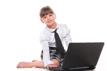 Attractive little girl with laptop