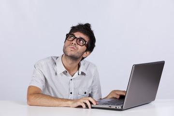 Young man working with his laptop