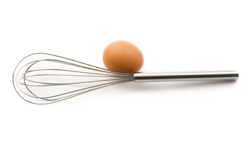 Eggbeater and egg isolated on white