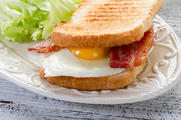 toasted bread with eggs and bacon