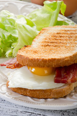 toasted bread with eggs and bacon
