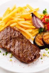 Steak with chips and vegetables