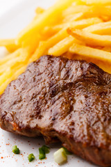 Steak with chips and vegetables