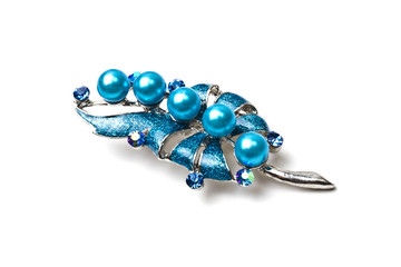 Beautiful blue brooch isolated on white