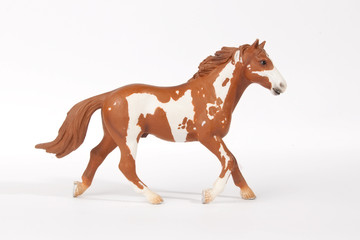 the statuette of a running horse