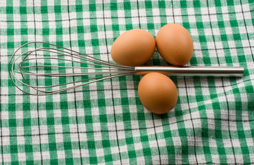 Eggbeater and eggs isolated