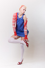 emotion pose blond girl in red woolly