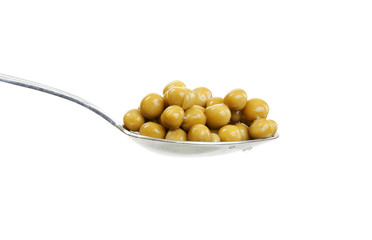 Spoon with green peas