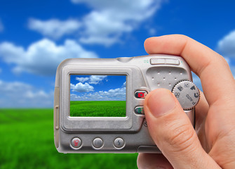 Hand holding digital camera