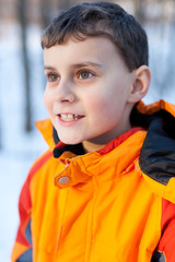 Cute little boy outdoor in the forest