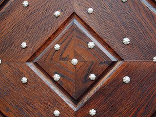 Detail of wooden door with rivets