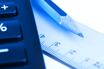 Ruler, calculator, and pencil close-up