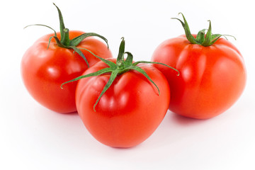 Fresh juicy tomatoes isolated on white