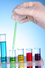 Test tubes over blue background