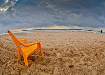 Fototapeta na wymiar Chair on the beach