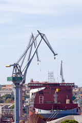 Fototapeta na wymiar Cargo ship in harbor service