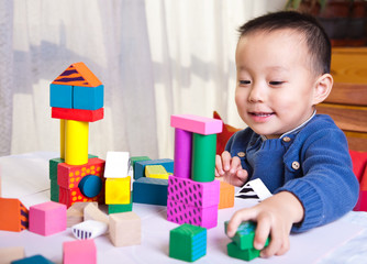 kid with toy blocks