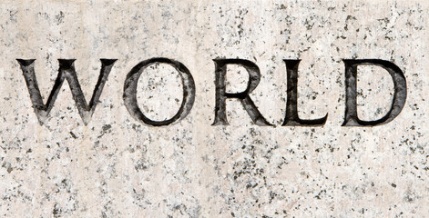 Word "World" Carved in Gray Granite Stone