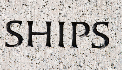 Word "Ships" Carved in Gray Granite Boats