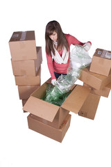 young girl packing up and moving - isolated