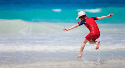 Little boy having fun at beach