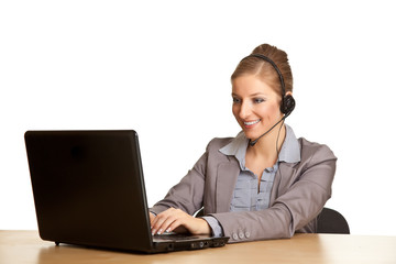 Woman in formal suit with headset isolated on white