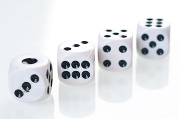 dices falling down against white background.