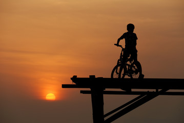 Obraz na płótnie Canvas A boy sitting on bicycle 3
