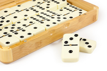 Opened bamboo box with domino