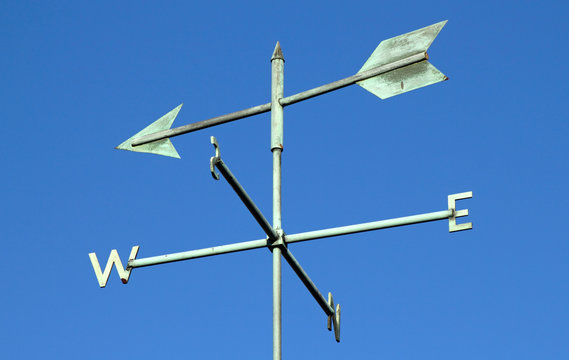 Weather vane and blue sky.