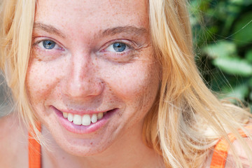Closeup portrait of young smiling woman