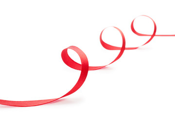 Red Christmas ribbon on white background