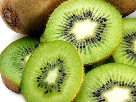 Sliced kiwi fruit on a white background