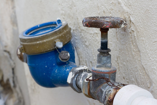 Rusting Old Water Valve With Water Meter