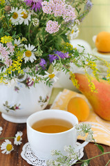 Field flowers and herbal tea (background)