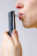 Alcoholometer - Women perform a test of alcohol