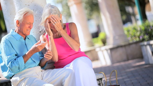 Senior Couple Enjoying a Cell Phone Call