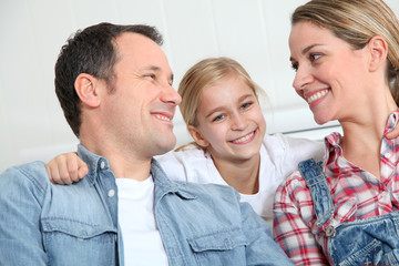 Portrait of happy couple with little girl