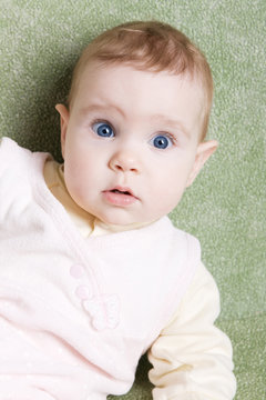 Cute astonished baby