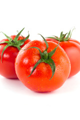 Red juicy tomatoes isolated on white