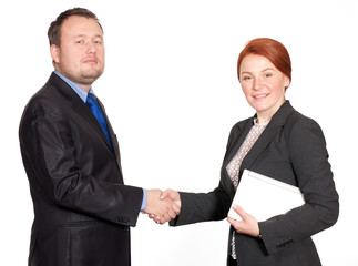 Handshake between businessman and businesswoman