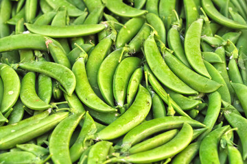 Unshelled sugar peas background