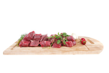beef meat fillet on a wooden plate with dill