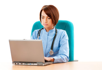 Young female doctor working at the computer