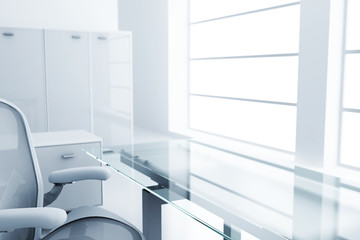 Light modern cubicle with a table and an armchair