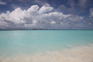 Fototapeta na wymiar An island landscape in Maldives with cloudy sky