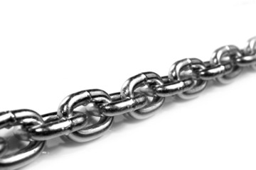 Obraz premium Links of a metal chain on a white background